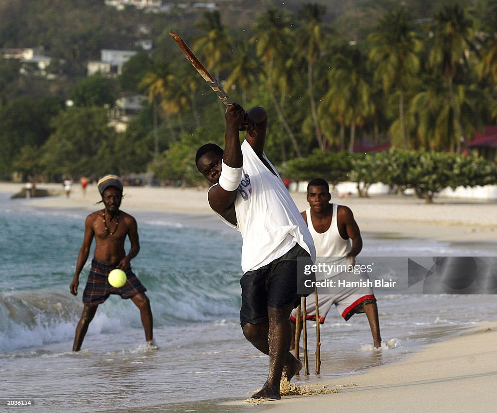 Locals play cricket on the beach