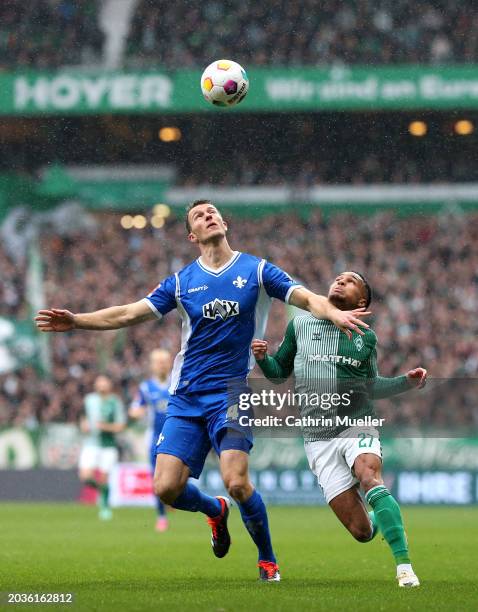 Christoph Zimmermann of SV Darmstadt 98 battles for possession with Felix Agu of SV Werder Bremen during the Bundesliga match between SV Werder...