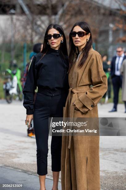 Gilda Ambrosio wears black cropped pants, jacket, heels & Giorgia Tordini wears brown wild leather coat, boots outside Ferragamo during the Milan...