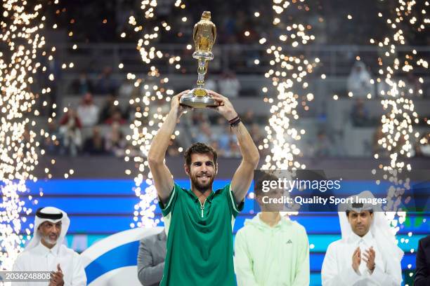 Karen Khachanov celebrates with the champions trophy after defeating Jakub Mensik of Czech Republic in their Final match during the Qatar ExxonMobil...