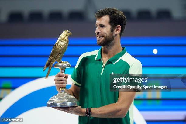 Karen Khachanov poses with the champions trophy after defeating Jakub Mensik of Czech Republic in their Final match during the Qatar ExxonMobil Open...