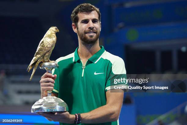 Karen Khachanov poses with the champions trophy after defeating Jakub Mensik of Czech Republic in their Final match during the Qatar ExxonMobil Open...