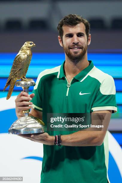 Karen Khachanov poses with the champions trophy after defeating Jakub Mensik of Czech Republic in their Final match during the Qatar ExxonMobil Open...