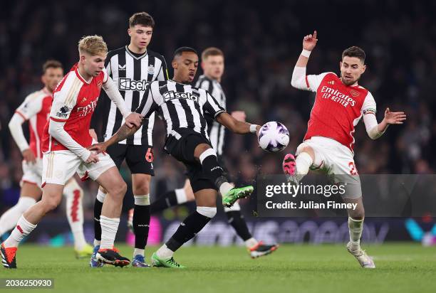 Joe Willock of Newcastle United battles for possession with Emile Smith Rowe and Jorginho of Arsenal during the Premier League match between Arsenal...