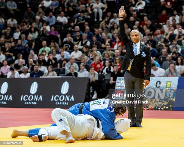 Referee Olivier Desroses of France signals ippon as Kayra Ozdemir of Turkey holds and controls Olympic and World medalist, Raz Hershko of Israel for...