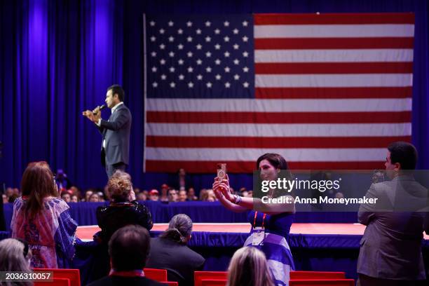 Woman takes a selfie as Former Presidential candidate Vivek Ramaswamy, speaks at the Conservative Political Action Conference at the Gaylord National...