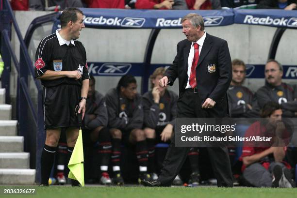 Alex Ferguson, Manchester United Manager complains to assistant Referee during the Premier League match between Bolton Wanderers and Manchester...