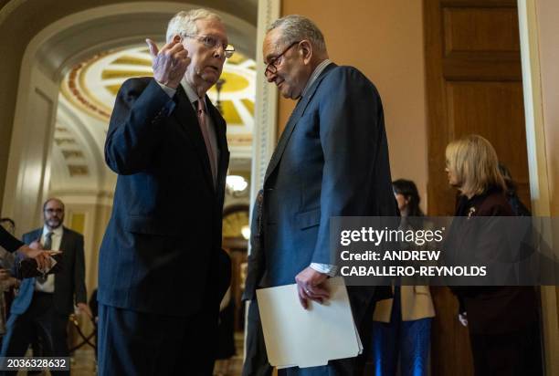 Senate Majority Leader Chuck Schumer speaks with US Minority Leader Mitch McConnell at the US Capitol, on February 27, 2024 in Washington, DC. Biden...