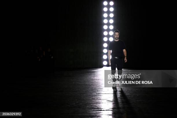 Belgian-Italian fashion designer Anthony Vaccarello acknowledges the audience after presenting creations by Saint Laurent for the Women Ready-to-wear...