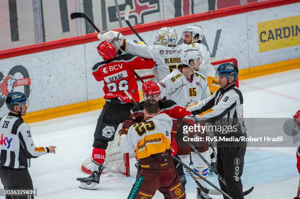 Jiri Sekac of Lausanne HC clashes with Goalie Jussi Olkinuora of Geneve-Servette HC during the Swiss National League match between Lausanne HC and...