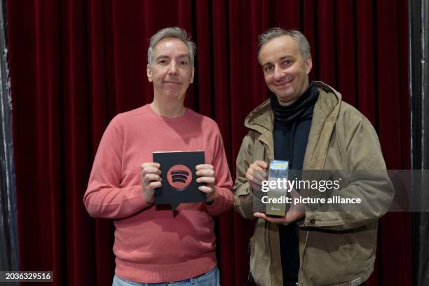 February 2024, North Rhine-Westphalia, Duesseldorf: Olli Schulz and Jan Böhmermann hold a Spotify Award in their hands before a concert by Olli...