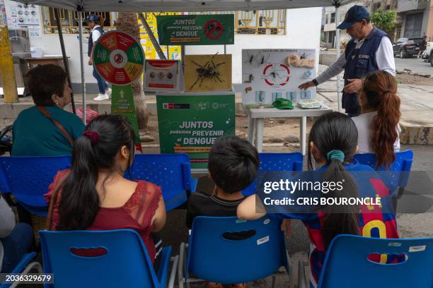 Brigadier of the Peruvian Ministry of Health instructs residents of the populous district of El Agustino on how to avoid and the dangers of Dengue,...