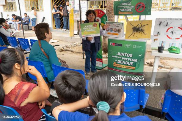 Brigadier of the Peruvian Ministry of Health instructs residents of the populous district of El Agustino on how to avoid and the dangers of Dengue,...