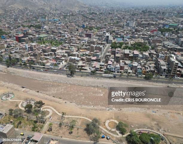 An aerial view of the populous district of El Agustino, where brigades of the Peruvian Ministry of Health are instructing residents on how to avoid...