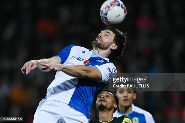 Blackburn Rovers' English striker Sam Gallagher heads the ball during the English FA Cup fifth round football match between Blackburn Rovers and...