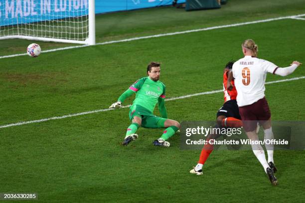 Erling Haaland of Manchester City scores their second goal past Luton Town goalkeeper Tim Krul during the Emirates FA Cup Fifth Round match between...