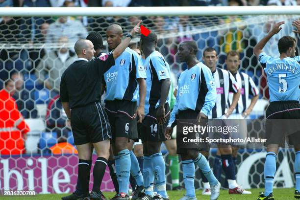 Referee Mike Dean sends off Papa Bouba Diop of Fulham with Red card during the Premier League match between West Bromwich and Fulham at The Hawthorns...