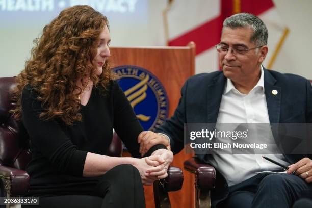 Health and Human Services Secretary Xavier Becerra offers comfort to Stephanie Perry, an in-vitro fertilization patient at the University of Alabama...