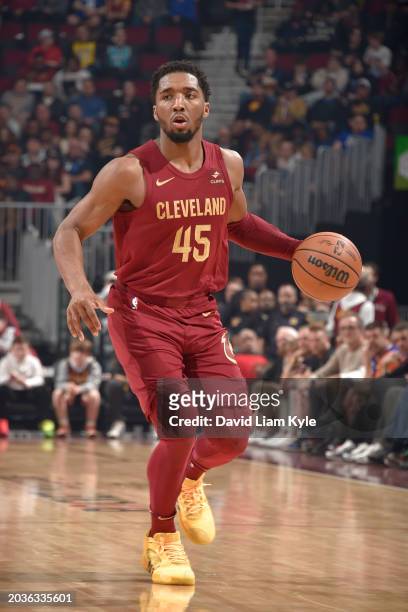 Donovan Mitchell of the Cleveland Cavaliers dribbles the ball during the game against the Dallas Mavericks on February 27, 2024 at Rocket Mortgage...