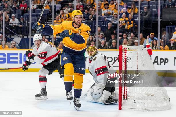 Roman Josi of the Nashville Predators scores a goal against Joonas Korpisalo of the Ottawa Senators during an NHL game at Bridgestone Arena on...