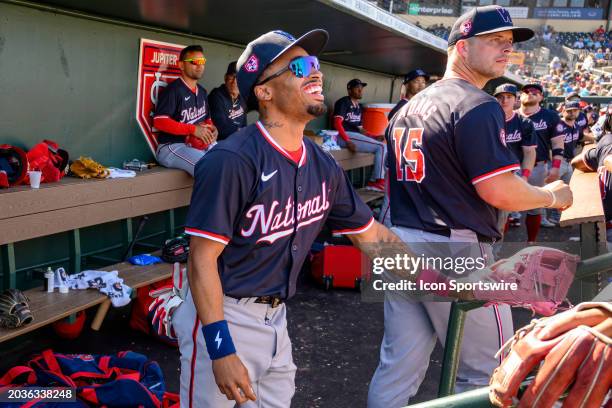 Washington Nationals infielder Nasim Nunez laughs in the dugout during an MLB spring training game between the Washington Nationals and the Miami...