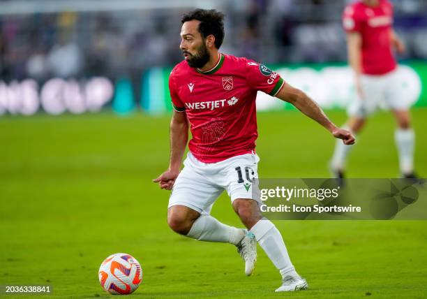 Cavalry forward Sergio Camargo looks to pass the ball during the MLS soccer match between the Orlando City SC and Cavalry FC on February 27th, 2024...