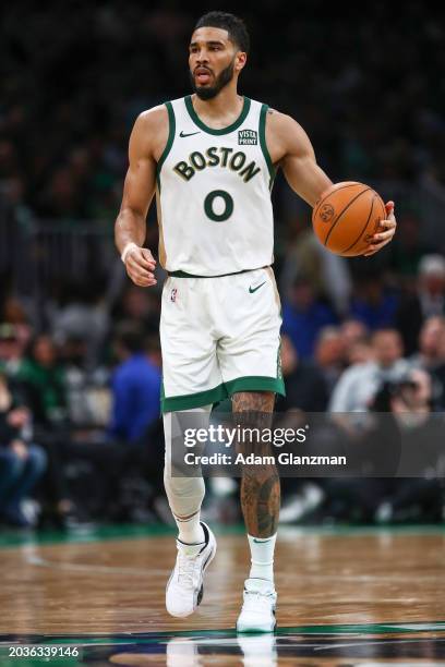 Jayson Tatum of the Boston Celtics dribbles down court during a game against the Philadelphia 76ers at TD Garden on February 27, 2024 in Boston,...