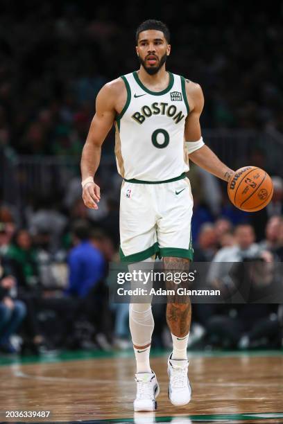 Jayson Tatum of the Boston Celtics dribbles down court during a game against the Philadelphia 76ers at TD Garden on February 27, 2024 in Boston,...