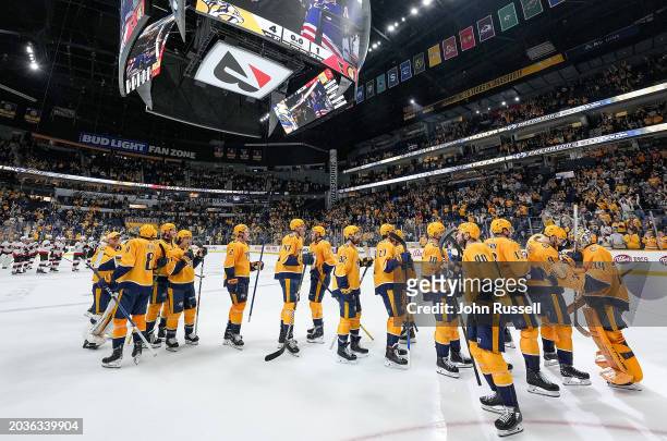 The Nashville Predators celebrate a 4-1 win against the Ottawa Senators during an NHL game at Bridgestone Arena on February 27, 2024 in Nashville,...