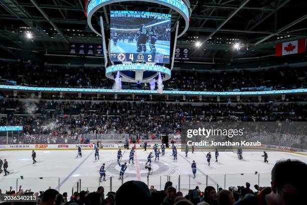 Winnipeg Jets salute the fans following a 4-2 victory over the St. Louis Blues at the Canada Life Centre on February 27, 2024 in Winnipeg, Manitoba,...