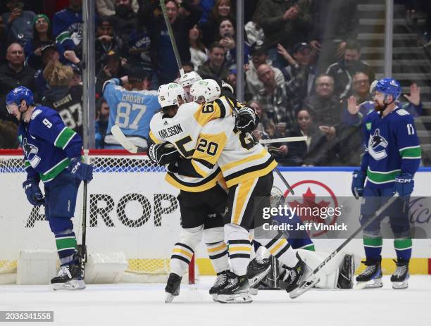 Erik Karlsson of the Pittsburgh Penguins makes an overtime goal on Thatcher Demko of the Vancouver Canucks during their NHL game at Rogers Arena on...