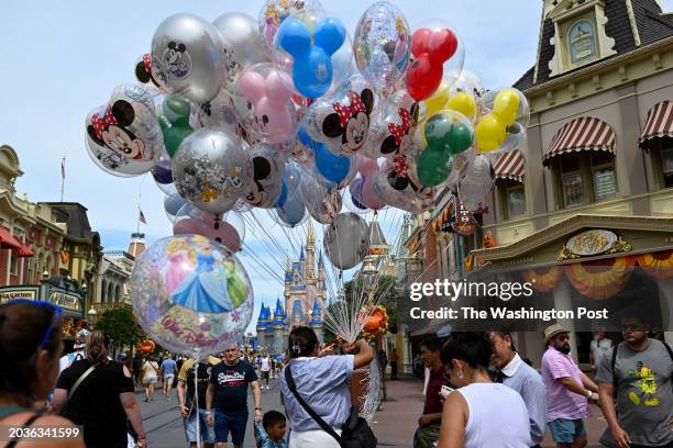 Vendor sells balloons at Walt Disney World at Magic Kingdom on Wednesday, September 26, 2023 in Bay Lake, Florida. Disney is suing Florida's Governor...