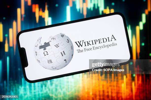 In this photo illustration a Wikipedia logo seen displayed on a smartphone.