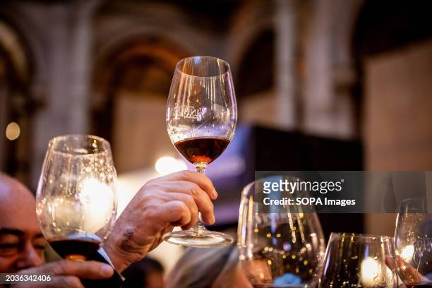 People make a toast during the Essence of Wine event. Essência do Vinho commemorates its 20th-year milestone at the iconic Palácio da Bolsa from Feb...