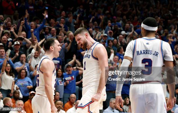 Nicolas Timberlake and Hunter Dickinson of the Kansas Jayhawks react after Timberlake drew a foul upon scoring during the 1st half of the game...