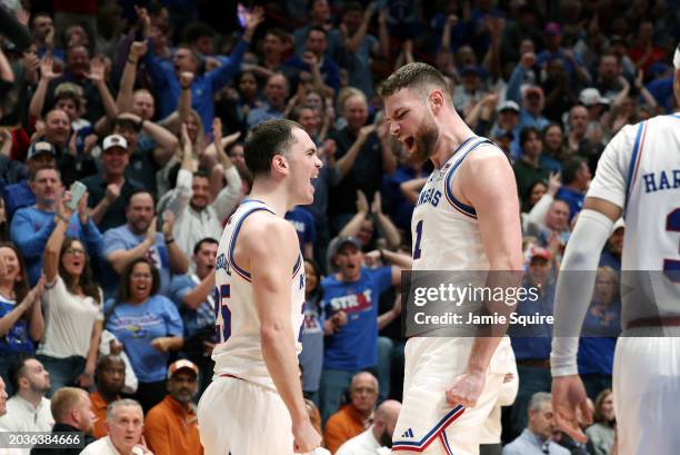 Nicolas Timberlake and Hunter Dickinson of the Kansas Jayhawks react after Timberlake drew a foul upon scoring during the 1st half of the game...