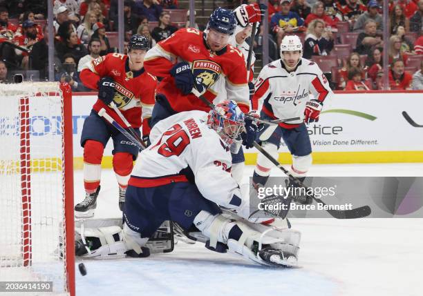 Carter Verhaeghe of the Florida Panthers watches a second period goal by Nick Cousins get past Charlie Lindgren of the Washington Capitals at Amerant...