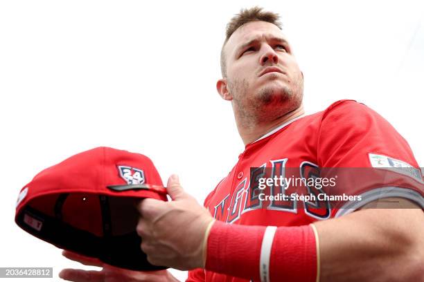 Mike Trout of the Los Angeles Angels looks on during a spring training exhibition against the Los Angeles Dodgers at the Peoria Sports Complex on...