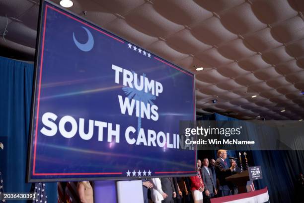 Television announcing "Trump Wins South Carolina" is seen while Republican presidential candidate and former President Donald Trump speaks during an...