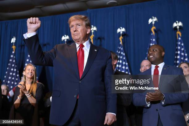 Republican presidential candidate and former President Donald Trump gestures to supporters during an election night watch party at the State...