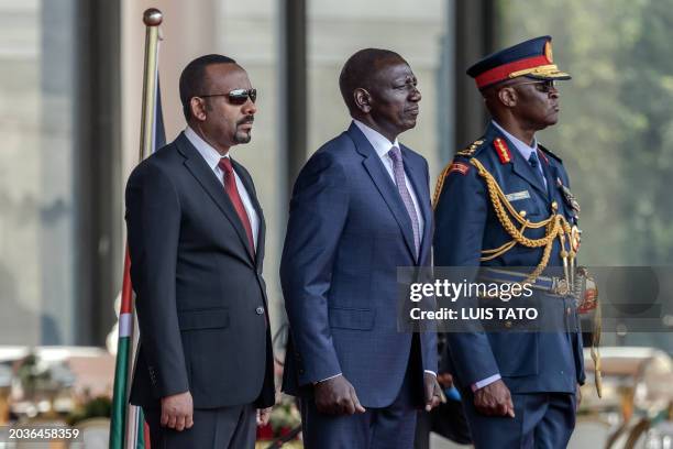 Prime Minister of Ethiopia Abiy Ahmed and President of Kenya William Ruto stand while inspecting a guard of honour by members of the Kenya Defence...