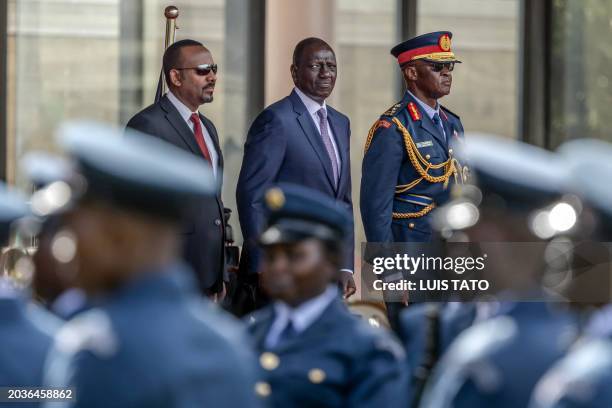 Prime Minister of Ethiopia Abiy Ahmed and President of Kenya William Ruto look on while inspecting a guard of honour by members of the Kenya Defence...