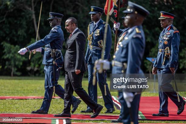 Prime Minister of Ethiopia Abiy Ahmed inspects a guard of honour by members of the Kenya Defence Forces during his official state visit to State...