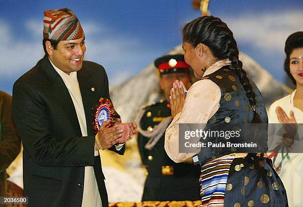 Nepalese Crown Prince Paras Bir Bikram Shah Dev greets Everest summiter Sherpa Pemba Doma during ceremonies celebrating the 50th anniversary of the...