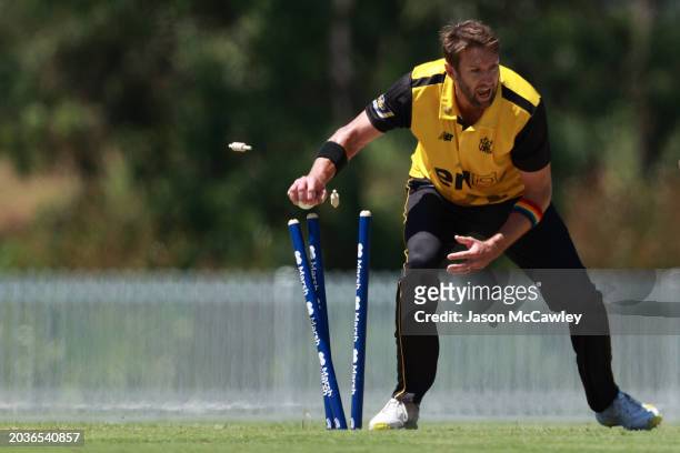Andrew Tye of Western Australia runs out Matthew Gilkes of the Blues during the March One Day Cup Final match between New South Wales Blues and...