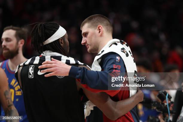 Jerami Grant of the Portland Trail Blazers, left, talks with Nikola Jokic of the Denver Nuggets, right, following a game at Moda Center on February...