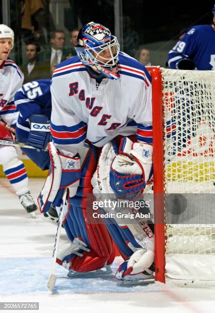 Mike Dunham of the New York Rangers skates against the Toronto Maple Leafs during NHL game action on December 2, 2003 at Air Canada Centre in...