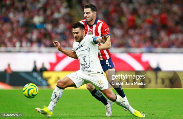 Eduardo Salvio of Pumas fights for the ball with Antonio Briseno of Chivas during the 8th round match between Chivas and Pumas UNAM as part of the...