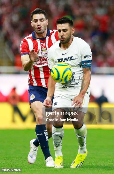 Antonio Briseno of Chivas fights for the ball with Eduardo Salvio of Pumas during the 8th round match between Chivas and Pumas UNAM as part of the...