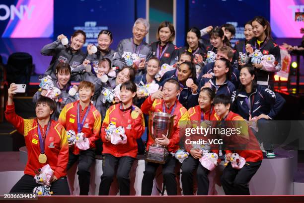 Gold medalists Team China, silver medalists Team Japan and bronze medalists Team Chinese Hong Kong pose for a group photo after the Final match on...